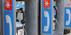 Payphone goes up, hangs up, coins