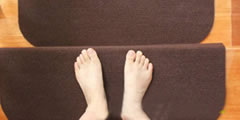 Barefoot steps on a wooden staircase covered with carpet sound , 2 sounds
