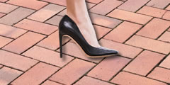 Steps on a brick floor in heels sound 