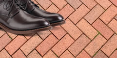 Steps on the brick floor in shoes sound 